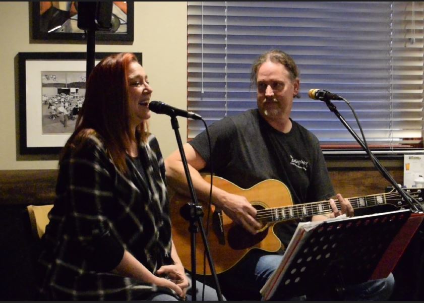 brad and charity perform