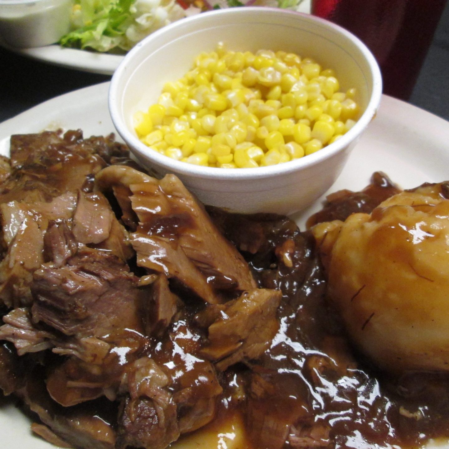 Oscar's open faced roast beef brisket - corn, salad and mashed potatoes
